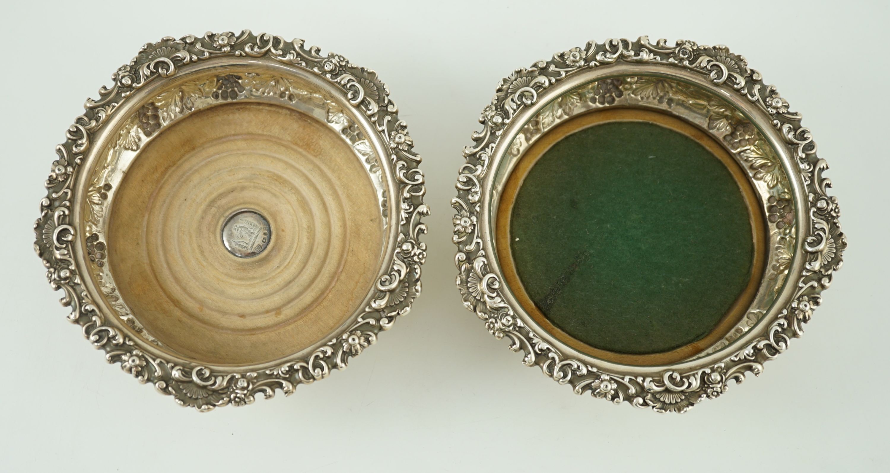 A pair of George IV silver mounted wine coasters, by S.C. Younge & Co